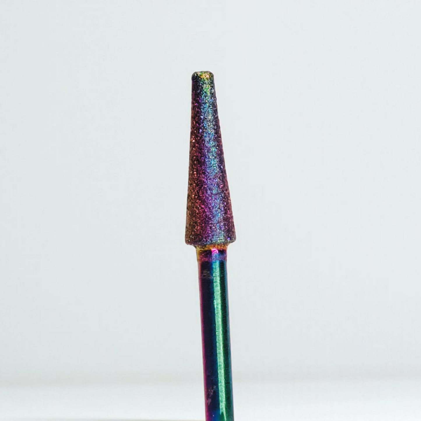 Multicolored cone-shaped object on a white background