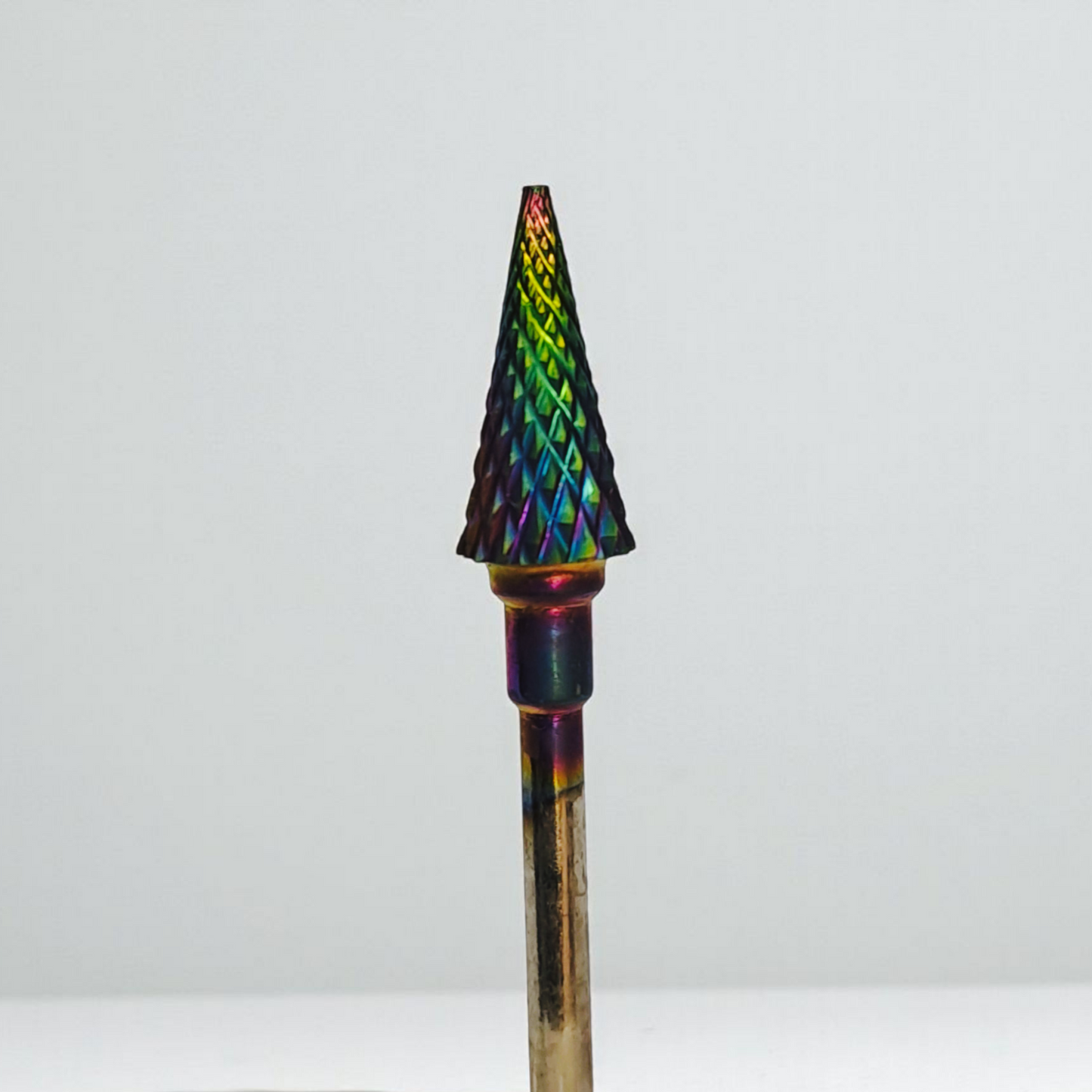 Multicolored pointed object on a white background