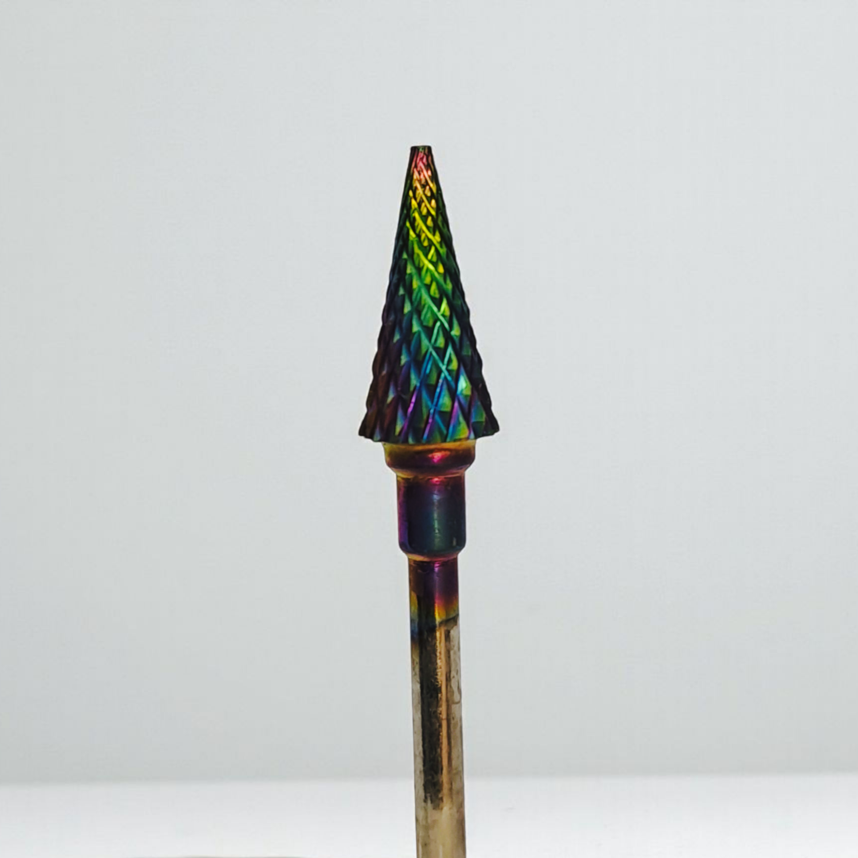 Multicolored pointed object on a white background